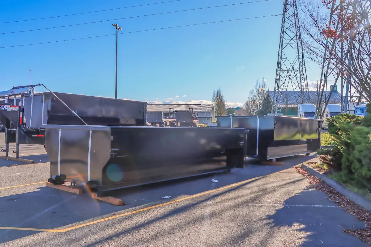 Roll-off dumpster ready for waste disposal at job site for Yard Waste Dumpster Rental in Wilmington